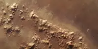 These “Scratches” On Mars Surround a Volcano As Wide As the USA