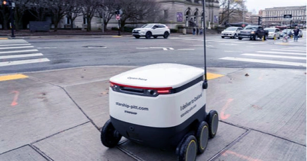 Robotic Food Delivery Vehicle Speeds Past a Crime Scene