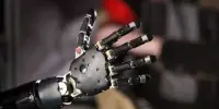 Cognitive Approaches to Augmenting the Human Body with a Wearable Robotic Arm